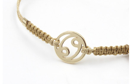 Pulsera hilo macrame oro palido con nudo dorado di