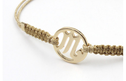Pulsera hilo macrame oro palido con nudo dorado di