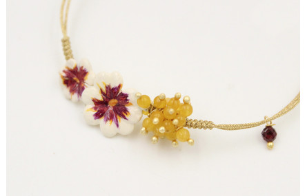 Pulsera nudo serpiente oro pálido con flores esmal