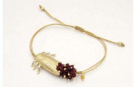 Pulsera nudo serpiente oro pálido con cigarra oro 