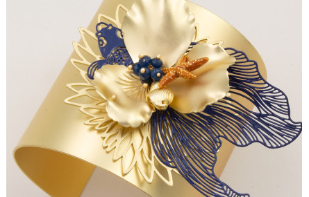 Brazalete rigido flor de loto,pez tropical azul os